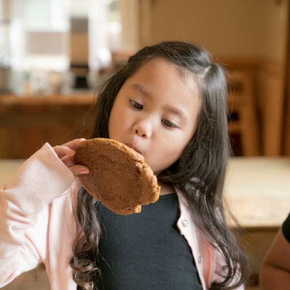 Young girl with cookie a The Sugar Shack