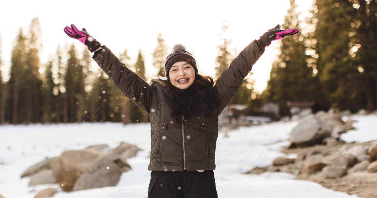 Girl at Pinecrest Lake in snow