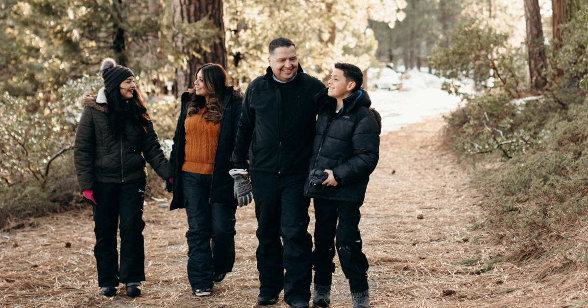 Family walking at Pinecrest Lake in winter