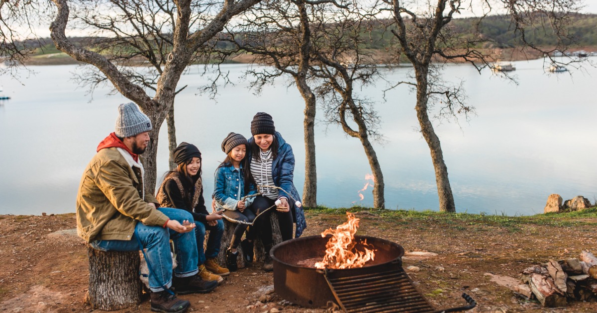 Family around campfire at Lake Don Pedro