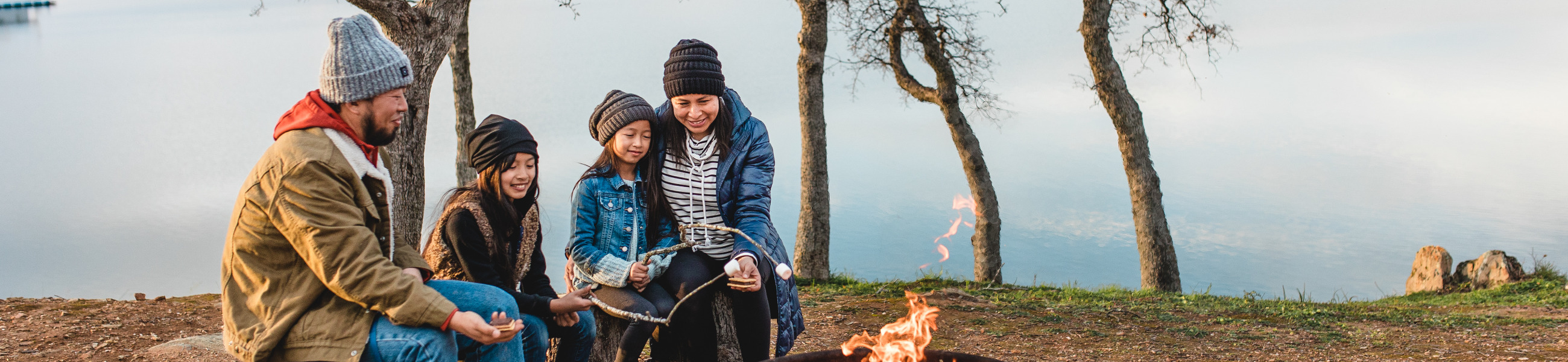 Family around campfire at Lake Don Pedro